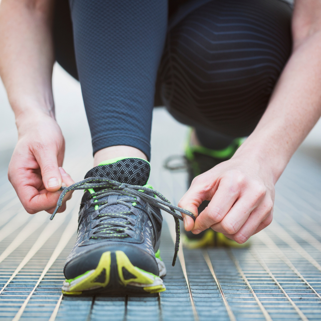 running tying their shoelace