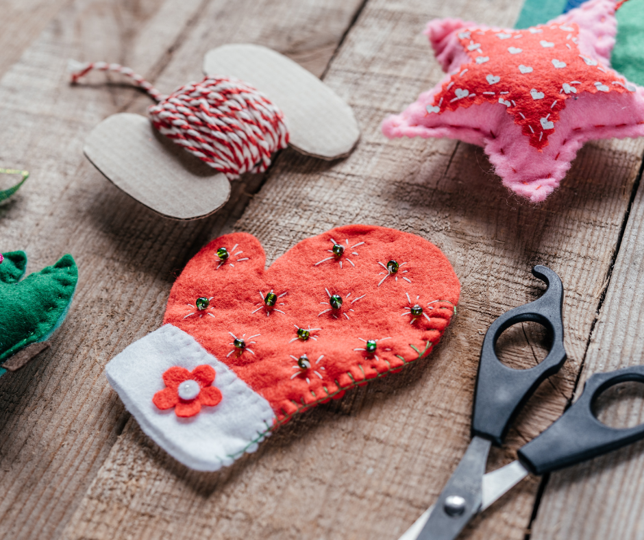 A selection of Christmas crafts laid on a wooden table