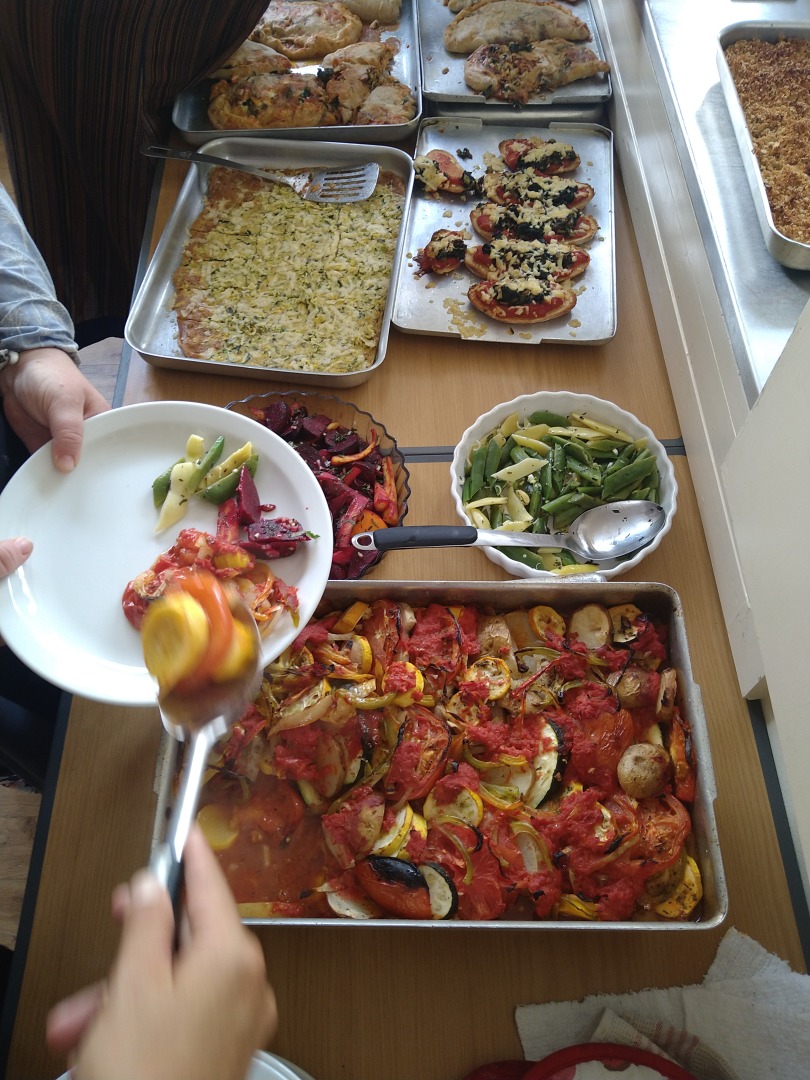 a shared meals being served on a large dining table