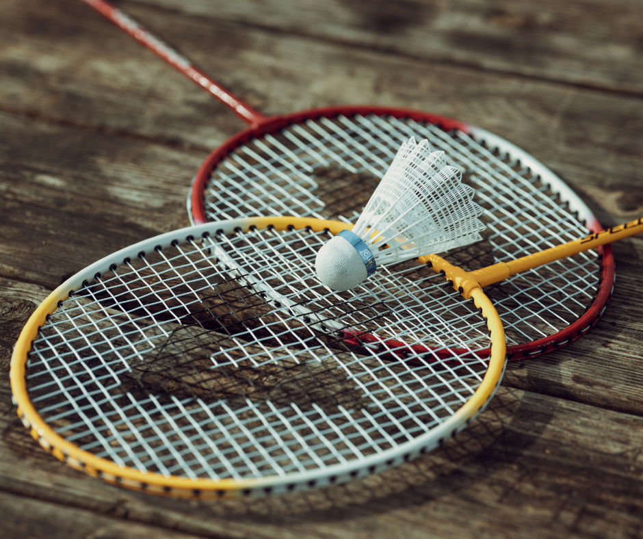Badminton rackets laying on the floor