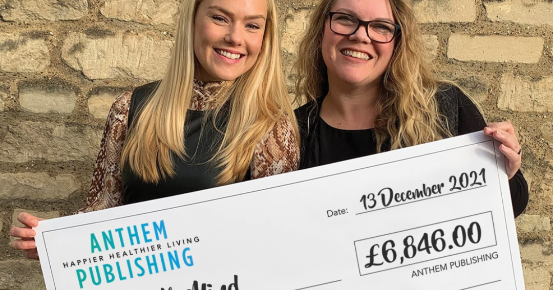 Two women holding a cheque to Bath Mind
