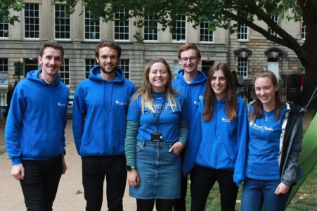 A group of people wearing blue Bath Mind t-shirts