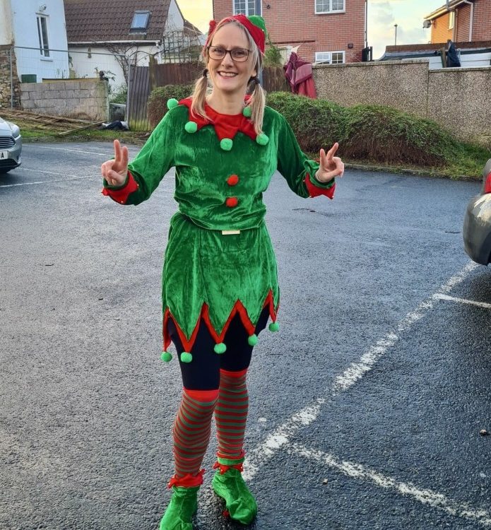 Someone dressed as an elf ready to run 5km