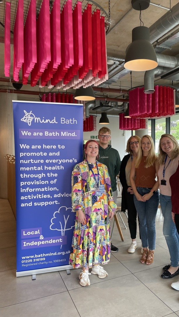 Bath Mind staff stood by a Bath Mind banner