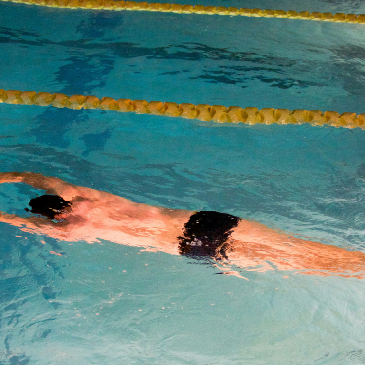 Someone swimming in a swimming pool