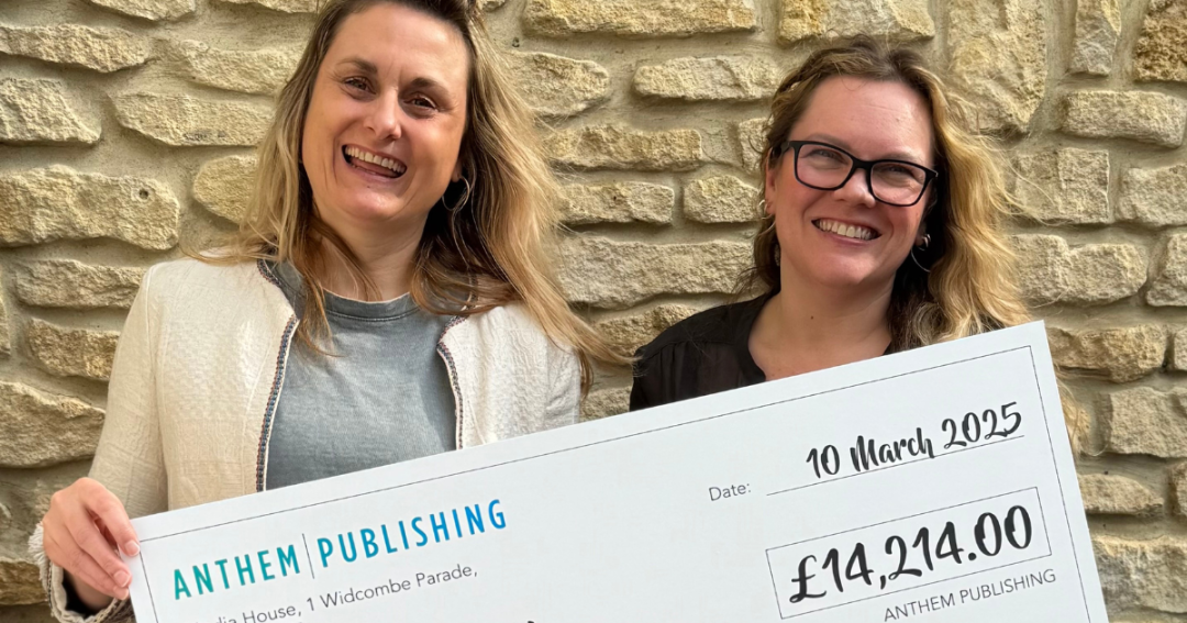 Jenny from Anthem Publishing and Becki from Bath Mind holding a cheque photo